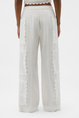 Profile view of model wearing the Oroton Handkerchief Pyjama Pant in Antique White and 100% mid-weight linen fabric for Women .