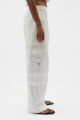 Profile view of model wearing the Oroton Handkerchief Pyjama Pant in Antique White and 100% mid-weight linen fabric for Women .