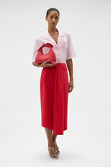 Profile view of model wearing the Oroton Short Sleeve Sheer Pocket Shirt in Rose and 100% cotton voile fabric for Women .
