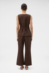 Profile view of model wearing the Oroton Kick Flare Cropped Pant in Espresso and 100% heavy weight linen fabric for Women .
