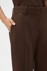 Profile view of model wearing the Oroton Kick Flare Cropped Pant in Espresso and 100% heavy weight linen fabric for Women .