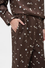 Profile view of model wearing the Oroton Mini Daisy Pyjama Pant in Milk Chocolate and 100% silk twill fabric for Women .