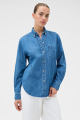 Profile view of model wearing the Oroton Denim Shirt in Denim and 100% cotton fabric for Women .