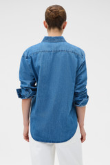 Profile view of model wearing the Oroton Denim Shirt in Denim and 100% cotton fabric for Women .