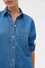 Profile view of model wearing the Oroton Denim Shirt in Denim and 100% cotton fabric for Women .