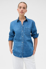 Profile view of model wearing the Oroton Denim Shirt in Denim and 100% cotton fabric for Women .