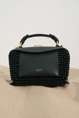Detail product shot of the Oroton Mica Beaded Mini Bowler in Black and Premium canvas material for Women .