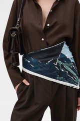 Profile view of model wearing the Oroton The Lightwater Scarf in Midnight Blue and 100% silk twill fabric for Women .
