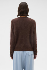 Profile view of model wearing the Oroton Cashmere Blend Cardigan in Dark Chocolate and 70% ultra-fine merino wool and 30% cashmere blend fabric for Women .