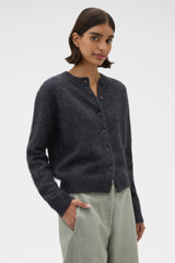 Profile view of model wearing the Oroton Cashmere Blend Cardigan in Charcoal and 70% ultra fine merino wool and 30% cashmere blend fabric for Women .