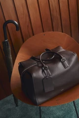 Detail product shot of the Oroton Paxton Weekender in Dark Chocolate and Premium pebble leather for Men .