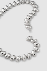 Detail product shot of the Oroton Penny Necklace in Silver and Brass material for Women .