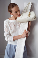 Profile view of model wearing the Oroton Drawn Thread Detail Blouse in White and 100% linen fabric for Women .