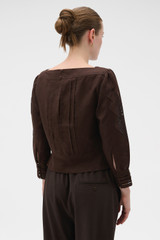 Profile view of model wearing the Oroton Drawn Thread Detail Blouse in Dark Chocolate and 100% linen fabric for Women .
