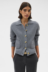 Profile view of model wearing the Oroton Waffle Cardigan in Grey Marle and 100% super soft merino wool fabric for Women .