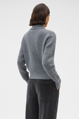 Profile view of model wearing the Oroton Waffle Cardigan in Grey Marle and 100% super soft merino wool fabric for Women .