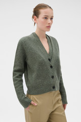Profile view of model wearing the Oroton V-Neckline Cardigan in Soft Khaki and 100% mid-gauge merino wool fabric for Women .