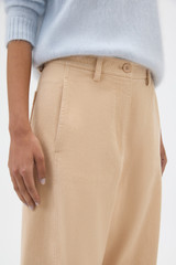 Profile view of model wearing the Oroton Barrel Twill Leg Pant in Biscotti and 100% cotton fabric for Women .