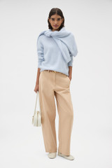 Profile view of model wearing the Oroton Barrel Twill Leg Pant in Biscotti and 100% cotton fabric for Women .