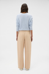 Profile view of model wearing the Oroton Barrel Twill Leg Pant in Biscotti and 100% cotton fabric for Women .
