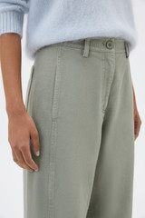 Profile view of model wearing the Oroton Barrel Twill Leg Pant in Silver Sage and 100% cotton fabric for Women .