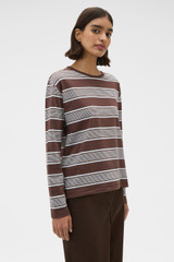 Profile view of model wearing the Oroton Long Sleeve Stripe Tee in Chocolate and 100% cotton fabric for Women .