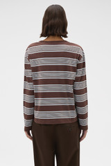 Profile view of model wearing the Oroton Long Sleeve Stripe Tee in Chocolate and 100% cotton fabric for Women .