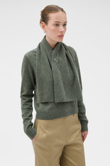Profile view of model wearing the Oroton Wrap Scarf Knit in Soft Khaki and 100% mid-gauge merino wool fabric for Women .