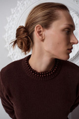 Profile view of model wearing the Oroton Embellished Rib Knit Crew in Dark Chocolate and 100% merino wool fabric for Women .