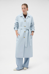 Profile view of model wearing the Oroton Essential Mac in Soft Smoke Blue and 77% cotton and 23% linen blend fabric for Women .
