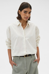 Profile view of model wearing the Oroton Dobby Stripe Shirt in Whipped Cream and 100% cotton fabric for Women .