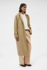Profile view of model wearing the Oroton Reversible Check Mac in Camel and 100% soft cotton fabric for Women .