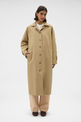 Profile view of model wearing the Oroton Reversible Check Mac in Camel and 100% soft cotton fabric for Women .
