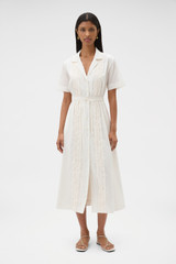 Profile view of model wearing the Oroton Ruffle Detail Shirt Dress in Cream and 100% cotton voile fabric for Women .