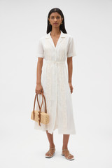 Profile view of model wearing the Oroton Ruffle Detail Shirt Dress in Cream and 100% cotton voile fabric for Women .