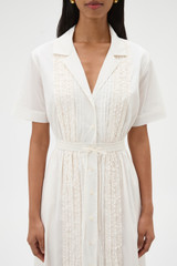 Profile view of model wearing the Oroton Ruffle Detail Shirt Dress in Cream and 100% cotton voile fabric for Women .