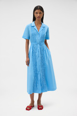 Profile view of model wearing the Oroton Ruffle Detail Shirt Dress in Sea Blue and 100% cotton voile fabric for Women .