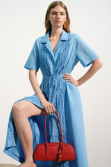 Profile view of model wearing the Oroton Ruffle Detail Shirt Dress in Sea Blue and 100% cotton voile fabric for Women .