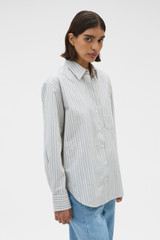 Profile view of model wearing the Oroton Soft Stripe Shirt in Soft Blue and 100% cotton fabric for Women .