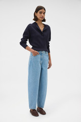 Profile view of model wearing the Oroton Barrel Leg Denim Jean in Light Vintage Wash and 100% cotton fabric for Women .