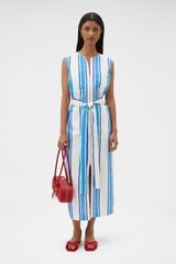Profile view of model wearing the Oroton Shore Stripe Day Dress in Sea Blue and 100% heavy linen fabric for Women .