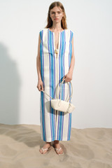Profile view of model wearing the Oroton Shore Stripe Day Dress in Sea Blue and 100% heavy linen fabric for Women .