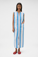 Profile view of model wearing the Oroton Shore Stripe Day Dress in Sea Blue and 100% heavy linen fabric for Women .