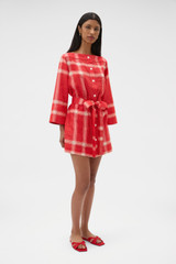 Profile view of model wearing the Oroton Vintage Check Tunic Dress in Ribbon Red and 100% midweight linen fabric for Women .