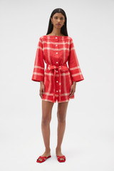 Profile view of model wearing the Oroton Vintage Check Tunic Dress in Ribbon Red and 100% midweight linen fabric for Women .