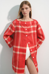 Profile view of model wearing the Oroton Vintage Check Tunic Dress in Ribbon Red and 100% midweight linen fabric for Women .