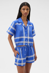 Profile view of model wearing the Oroton Vintage Check Short in Swedish Blue and 100% midweight linen fabric for Women .