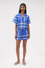 Profile view of model wearing the Oroton Vintage Check Short in Swedish Blue and 100% midweight linen fabric for Women .