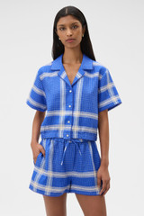 Profile view of model wearing the Oroton Vintage Check Short in Swedish Blue and 100% midweight linen fabric for Women .