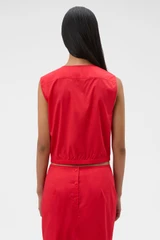 Profile view of model wearing the Oroton Ruffle Detail Top in Red Ribbon and 100% cotton voile fabric for Women .